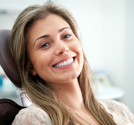 smiling patient in dentist chair